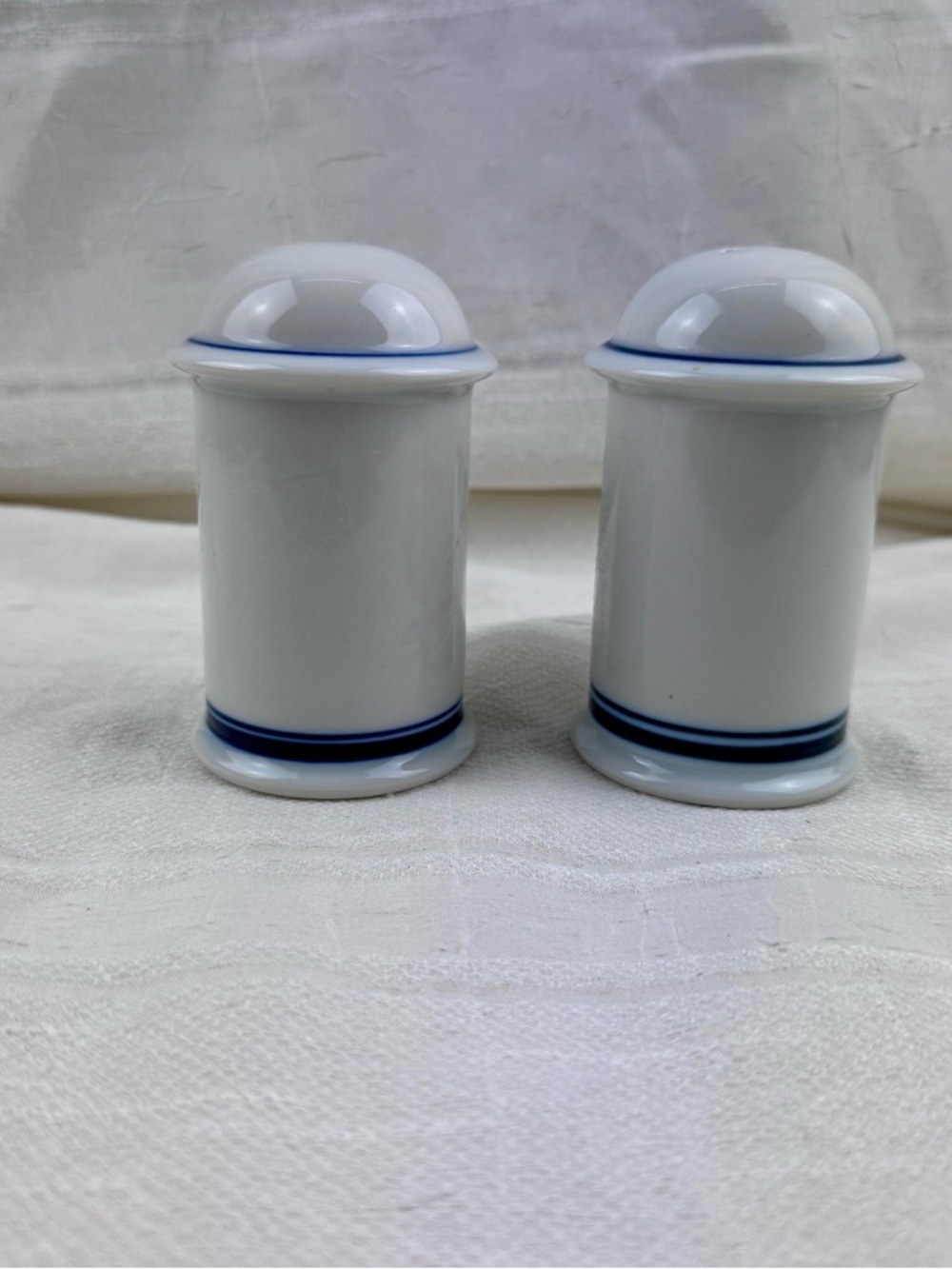Dansk White Ceramic Bistro Salt and Pepper Shakers with Gold Stamping